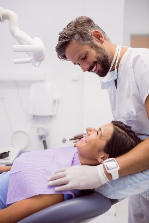 Dentist examining patient